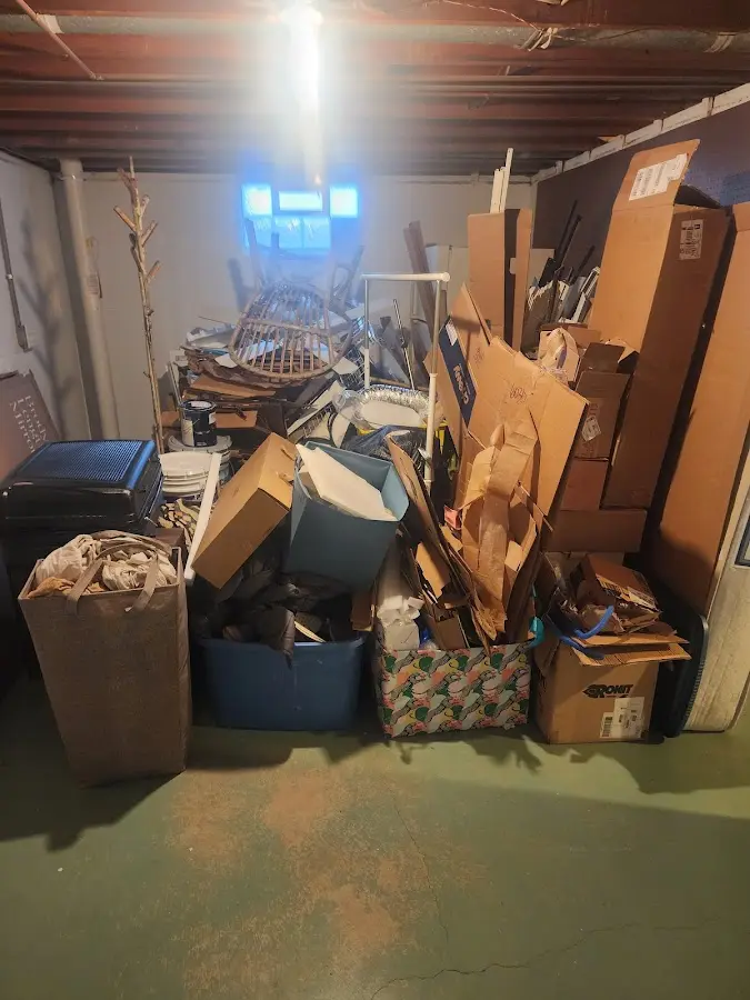 Roll-off dumpster container at job site for 2 Yard Dumpster Rental in Coleman