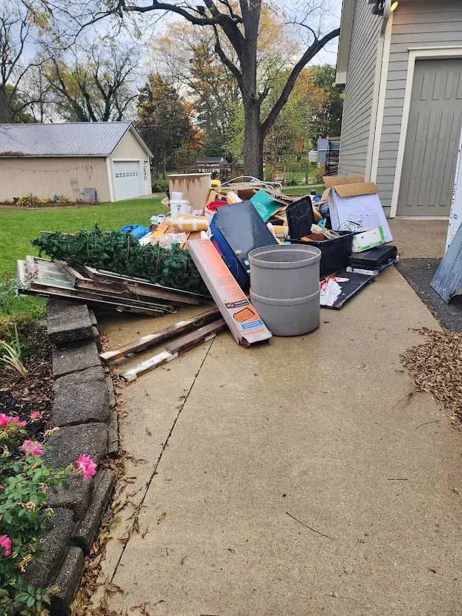 Dumpster being loaded with debris for Residential Dumpster Rental in Coleman